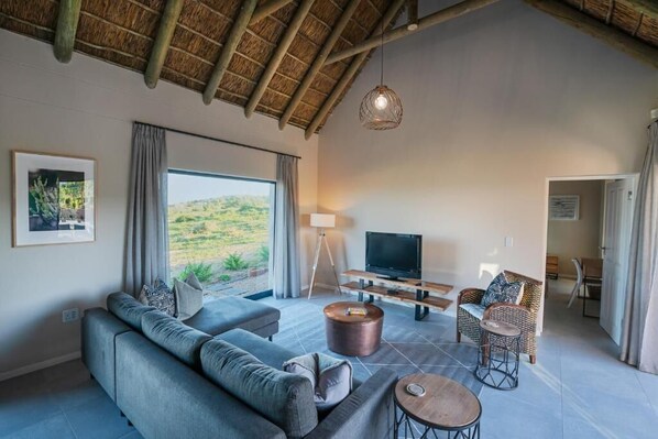 Executive Villa | Living area | 40-inch Smart TV with cable channels, fireplace