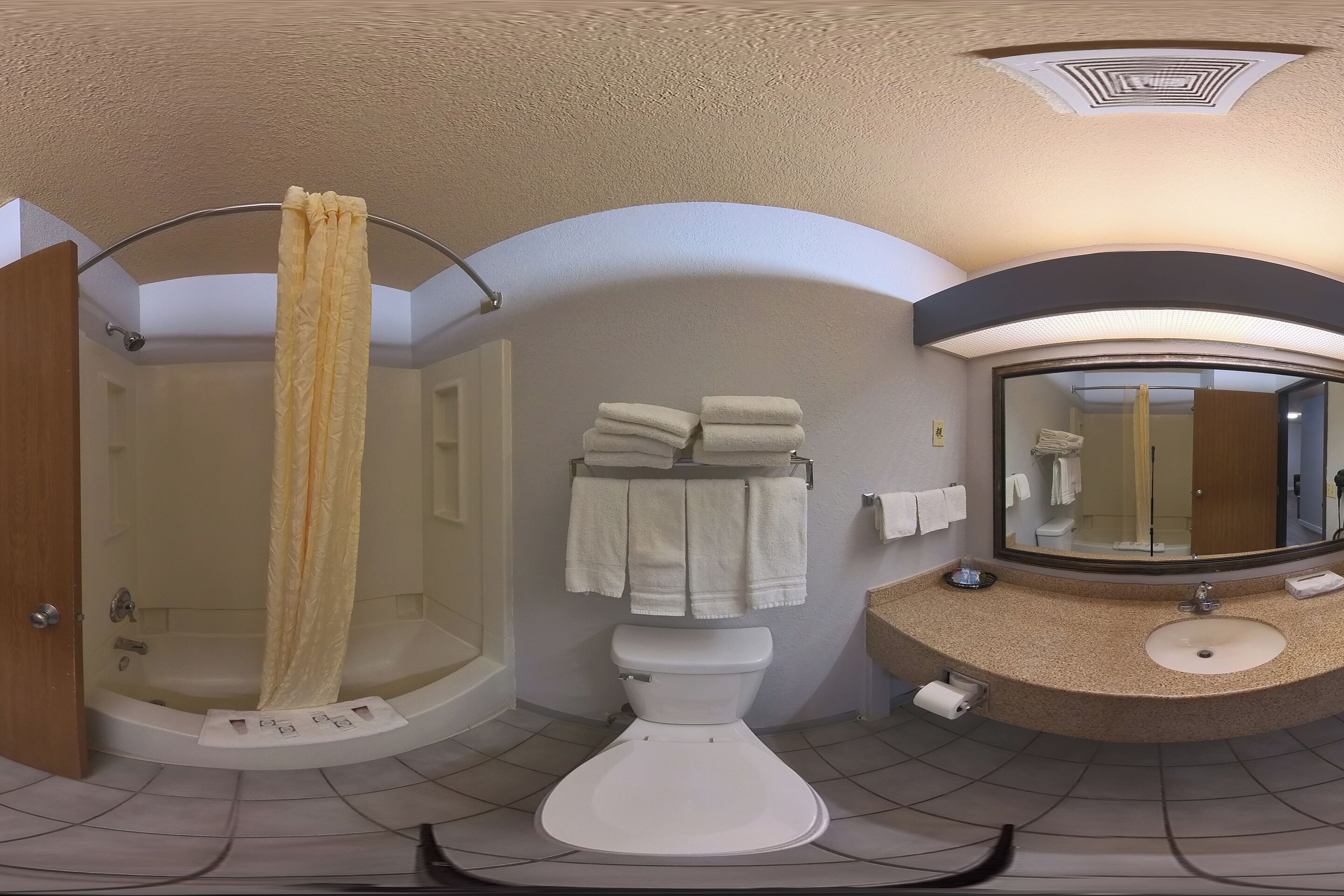 A modern bathroom with a bathtub, a toilet, and a sink.