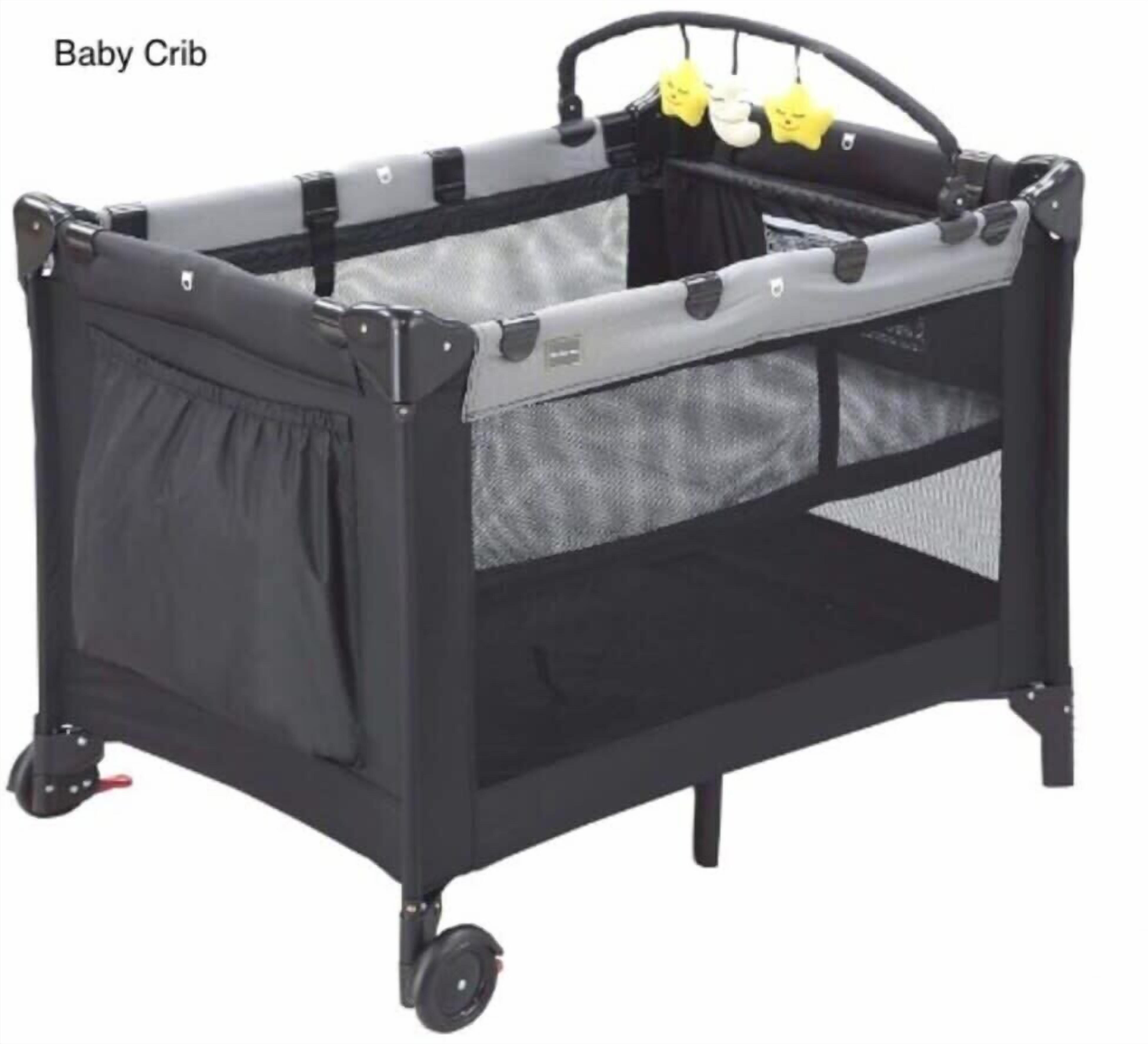 A baby crib with a mesh canopy, a front pocket, and wheels for mobility.