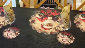 A fireplace mantel decorated with Christmas ornaments and a table set with festive tableware. - 7-bed Beachside Retreat - Sleeps 14 & Pet Friendly (Blackpool)