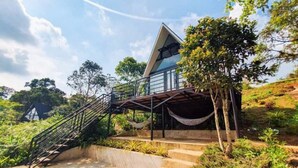 A modern villa with a triangular roof, a staircase leading to a balcony, and a pool area. - Viewscape Nature Park Tanay powered by Cocotel (Tanay)