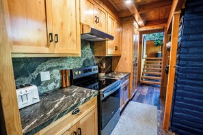 Fridge, oven, stovetop, dishwasher - Tucked in the trees, Cedar Hill is a cozy A-frame cabin with modern updates, a spacious kitchen, wraparound deck, and stunning views. The perfect mountain escape for families, couples, and friends—plus, it's pet-friendly! (Shaver Lake)