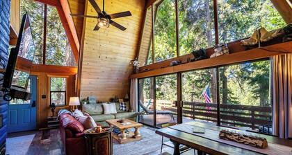 Tucked in the trees, Cedar Hill is a cozy A-frame cabin with modern updates, a spacious kitchen, wraparound deck, and stunning views. The perfect mountain escape for families, couples, and friends—plus, it's pet-friendly!