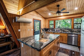 Fridge, oven, stovetop, dishwasher - Tucked in the trees, Cedar Hill is a cozy A-frame cabin with modern updates, a spacious kitchen, wraparound deck, and stunning views. The perfect mountain escape for families, couples, and friends—plus, it's pet-friendly! (Shaver Lake)
