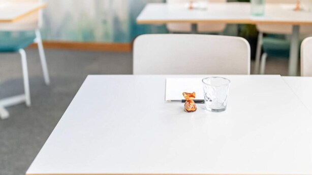 A conference room with a white table, chairs, and a glass of water. - 4 Star Holiday Home in Hisings Backa (Hisings Backa)