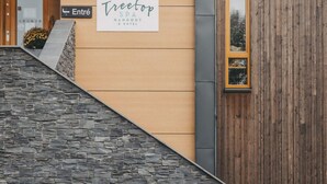 A building entrance with a sign for 'Treetop SPA HANGOUT & HOTEL'. - 4 Star Holiday Home in Hisings Backa (Hisings Backa)