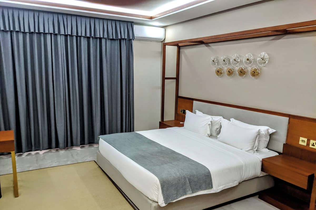 Premium bedding, pillow-top beds, desk, laptop workspace