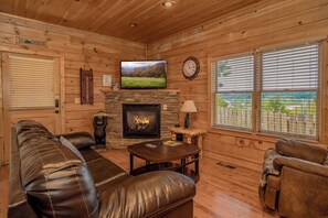 TV, fireplace - PFGetaway: Mtn & City Views, Hot Tub, Wifi, Games, Resort Pool, in Pigeon Forge! (Pigeon Forge)