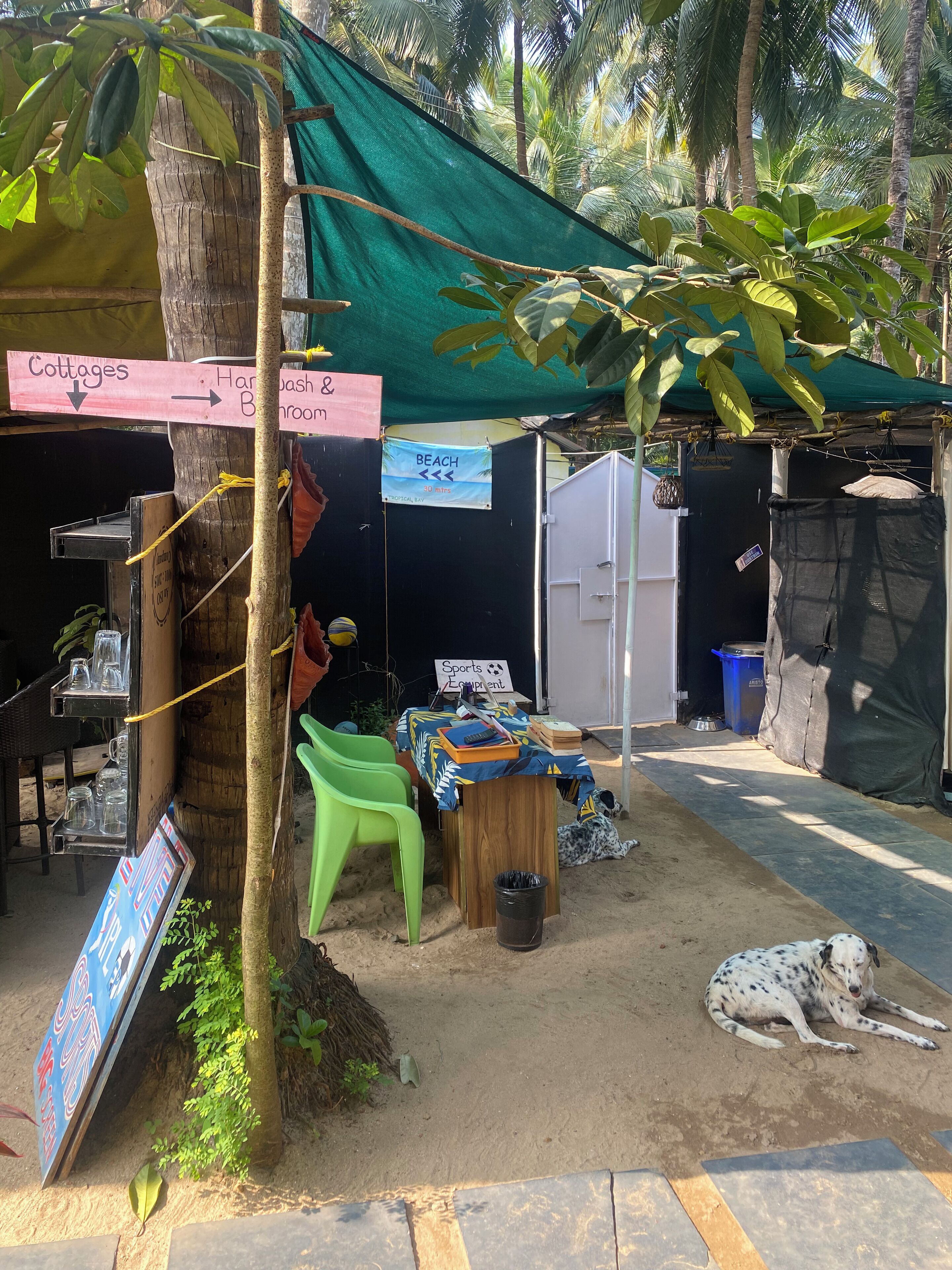 A beach-themed outdoor area with a sign indicating 'Cottages' and 'Harbour & Beach'.
