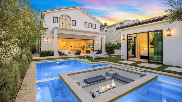 A two-story house with a swimming pool, outdoor seating, and a fire feature. - Villa Camellia - Charming 5 BR Home in the Heart of Studio City (Studio City)