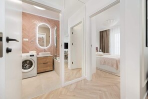 Shower, hair dryer, towels, shampoo