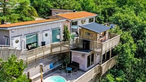 A multi-level wooden house with a hot tub, outdoor seating, and a balcony. - 4 Star Holiday Home in Hisings Backa (Hisings Backa)