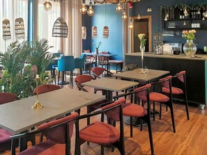 A restaurant interior with tables and chairs, a bar area, and decorative lighting. - 4 Star Holiday Home in Hisings Backa (Hisings Backa)