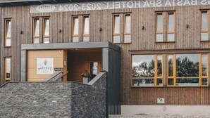 A modern building with a wooden facade, multiple windows, and a stone entrance. - 4 Star Holiday Home in Hisings Backa (Hisings Backa)