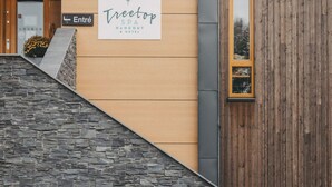 A building entrance with a sign for 'Treetop SPA HANGOUT & HOTEL'. - 4 Star Holiday Home in Hisings Backa (Hisings Backa)