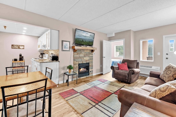 Curl up in the cozy living room & enjoy a fireside movie night at home