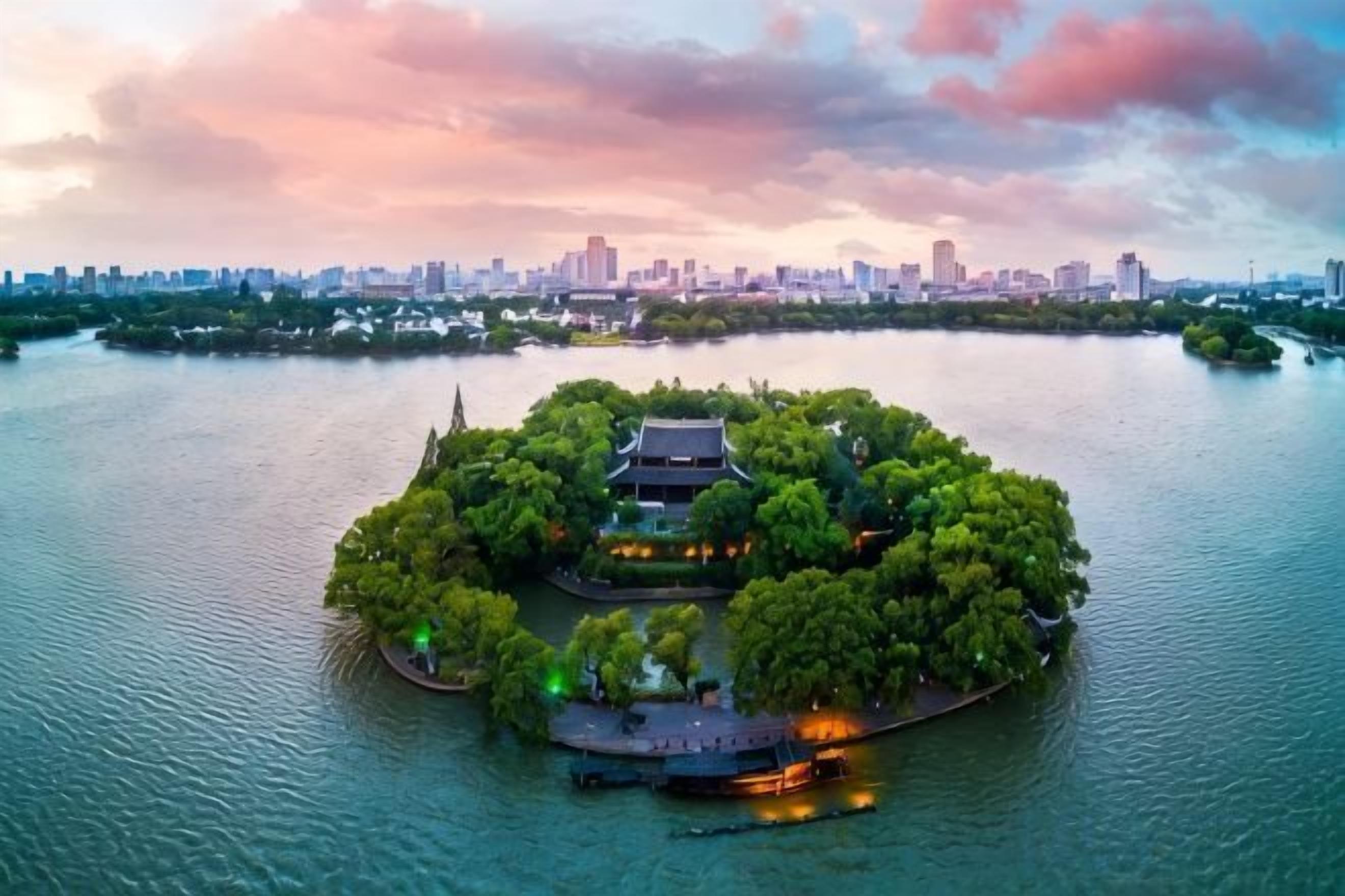 An island with traditional architecture surrounded by water, with a city skyline in the background.