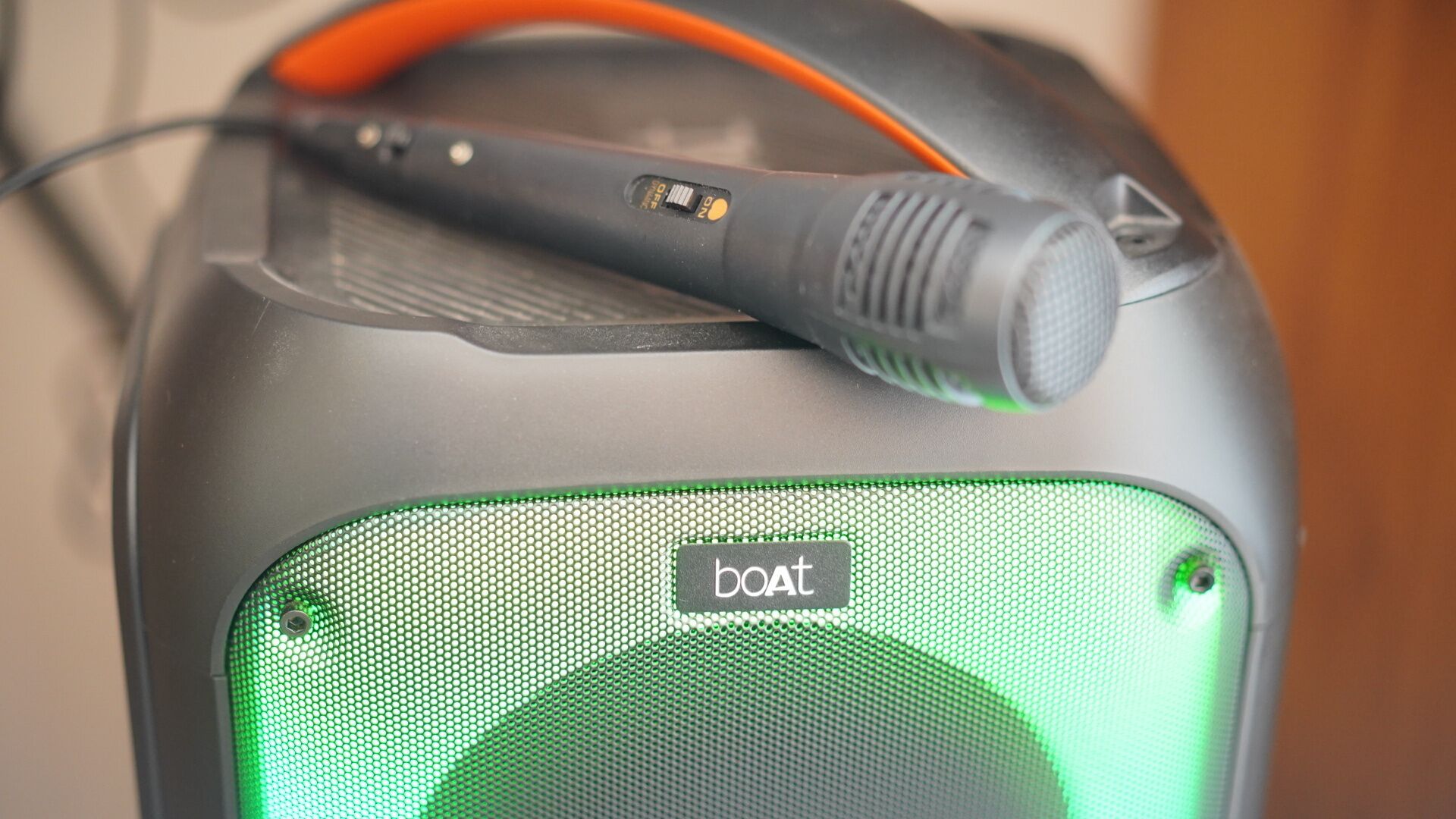 A portable speaker with a microphone attachment.
