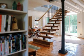 A staircase with wooden steps and a metal railing, leading to an upper floor. - Iron Mill House - Riverside Hot Tub - Frome (Somerset)