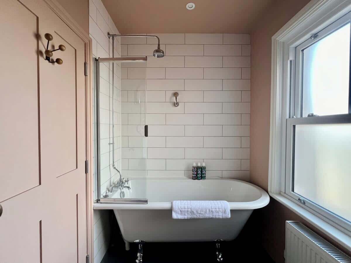 Shower, hair dryer, towels, shampoo