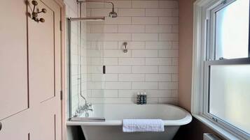 Shower, hair dryer, towels, shampoo