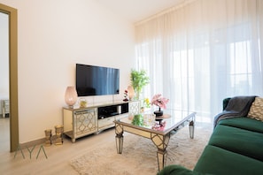 Deluxe Apartment, Balcony, City View | Living area - Aya - Elegant 1BR Retreat In The Heart Of JVC (Dubai)