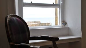 A chair by a window with a view of the sea. - Harbour Haven- idyllic coastal retreat (Anstruther)