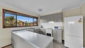 Microwave, dishwasher, dining tables
