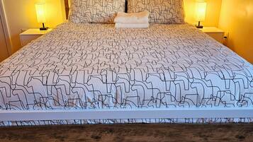 1 bedroom, desk, iron/ironing board, travel crib