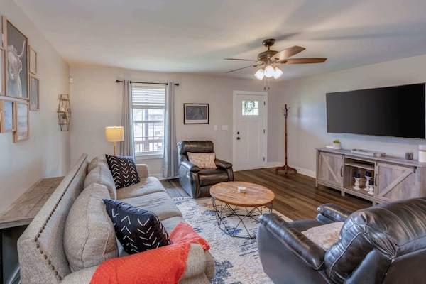 Cozy and spacious living area with TV