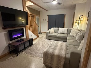 Smart TV, fireplace, DVD player, books