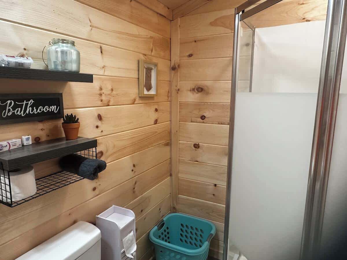 Shower, hair dryer, towels, shampoo