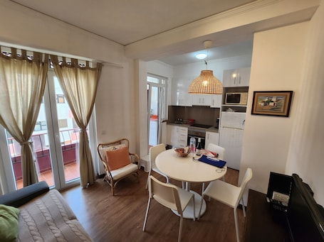 Comfort Apartment, Beach View | Living area | Flat-screen TV