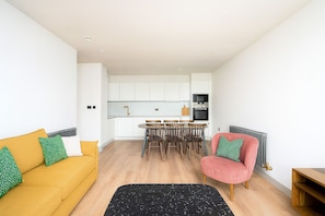 Superior Apartment, 3 Bedrooms | Living area | 32-inch flat-screen TV with digital channels