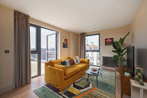 Classic Apartment, 1 King Bed | Living area | 32-inch flat-screen TV with digital channels