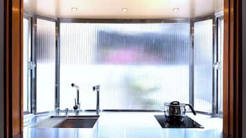 Mini-fridge, microwave, cookware/dishes/utensils