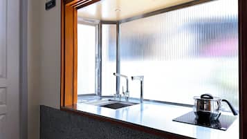 Mini-fridge, microwave, cookware/dishes/utensils