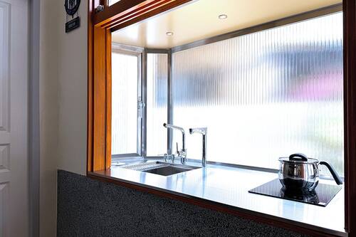 Mini-fridge, microwave, cookware/dishes/utensils