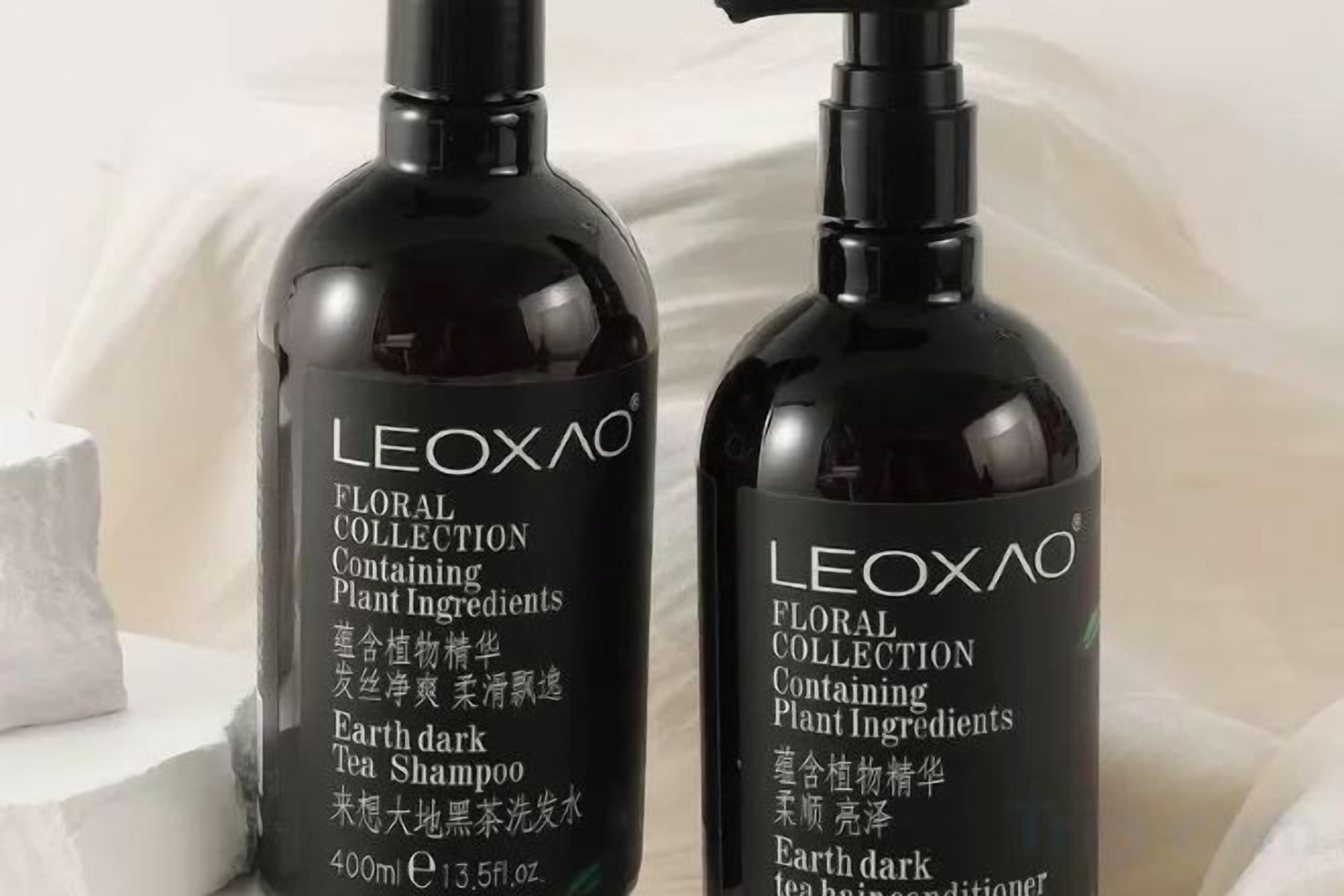 Two bottles of LEOXAO FLORAL COLLECTION Plant Ingredients Earth dark Tea Shampoo.