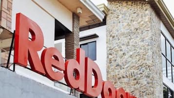 A RedBook sign on a building facade.
