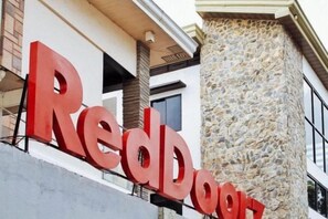 A RedBook sign on a building facade.