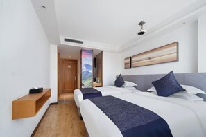A hotel room with two beds, a wooden shelf, a painting, and a door leading to another room. - Lanmei Boutique Hotel (Lanzhou Xiyuan) (Lanzhou)