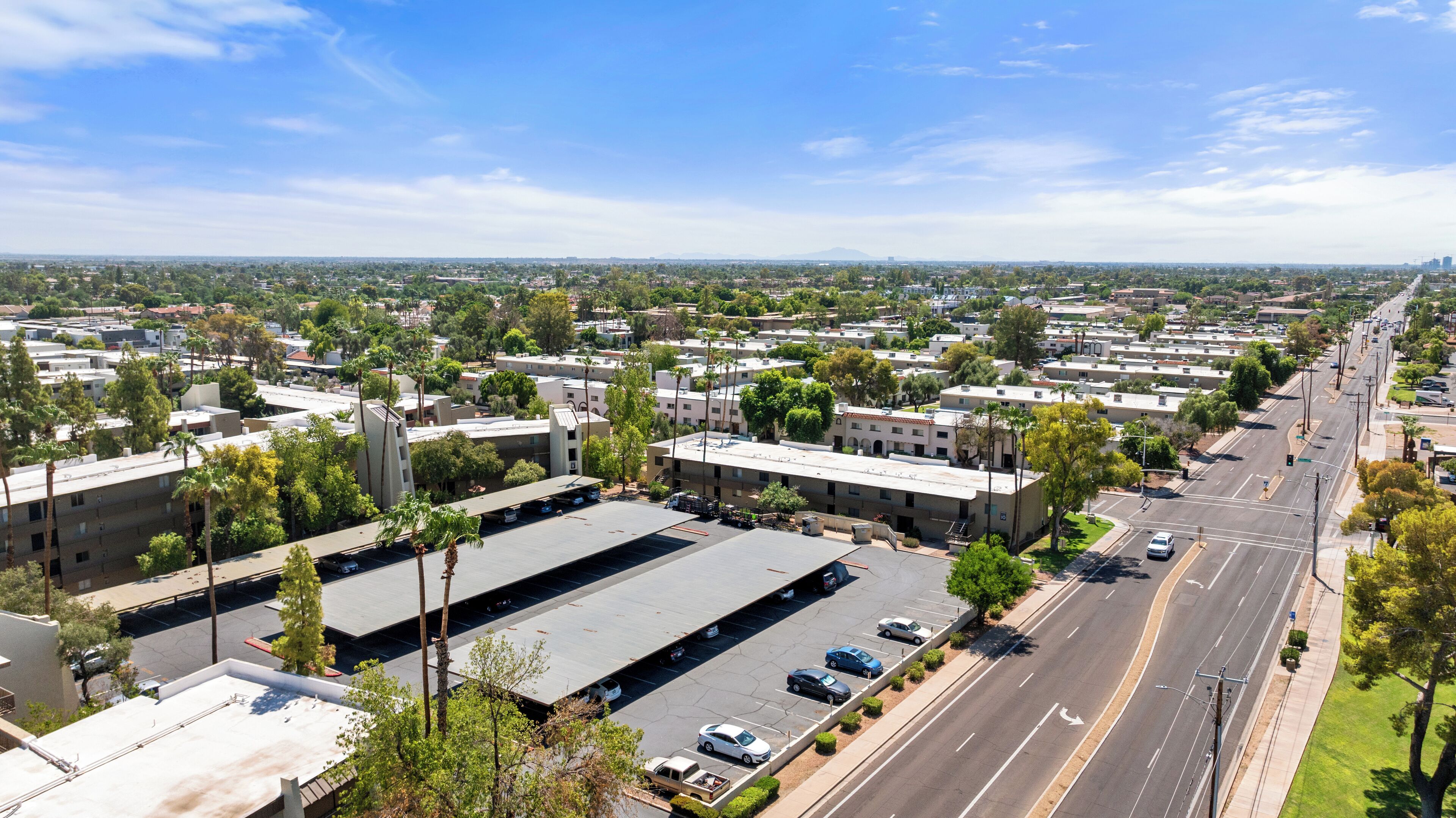 A large industrial area with warehouses and a wide road.