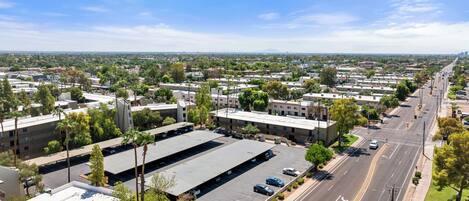 A large industrial area with warehouses and a wide road.