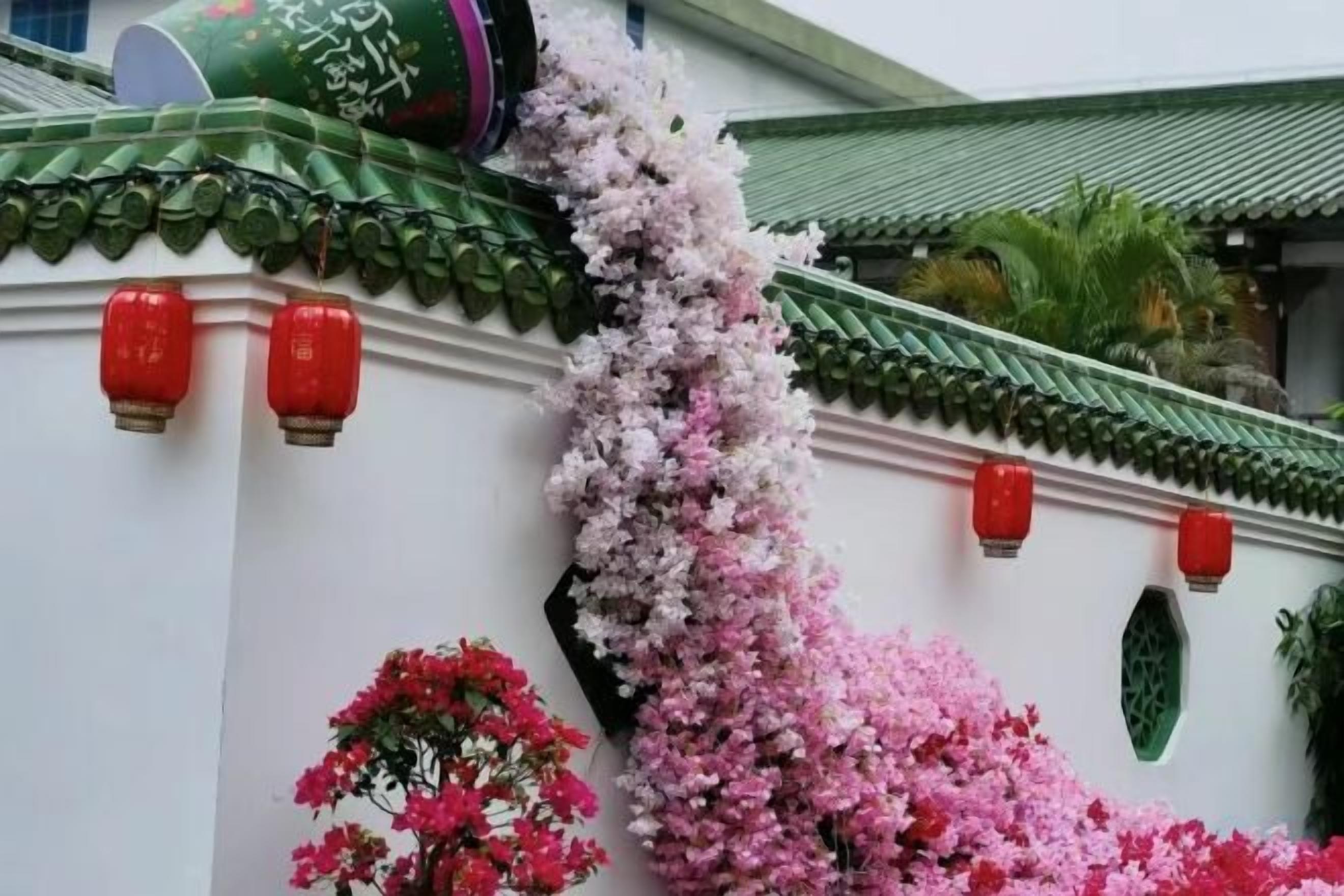A traditional building facade with decorative elements and lanterns.