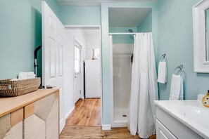 Shower, hair dryer, towels, toilet paper