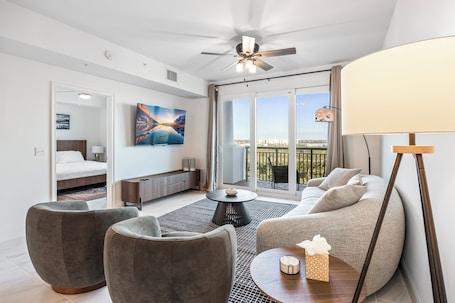 Deluxe Condo | Living area | 65-inch Smart TV with digital channels, streaming services