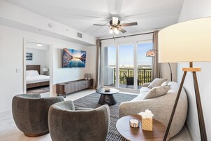 Deluxe Condo | Living area | 65-inch Smart TV with digital channels, streaming services