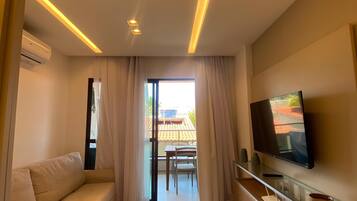 Deluxe Studio, 1 Double Bed with Sofa bed | Living area | TV