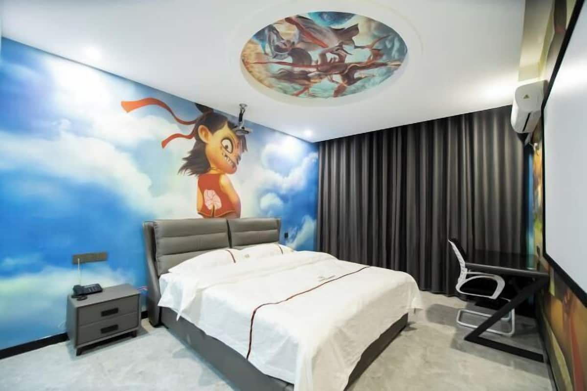 A bedroom with a bed, a nightstand, a chair, a ceiling mural, and a window with curtains.